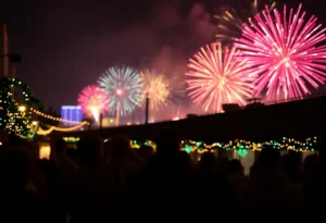 Colorful fireworks over San Antonio skyline during New Year's Eve celebration.